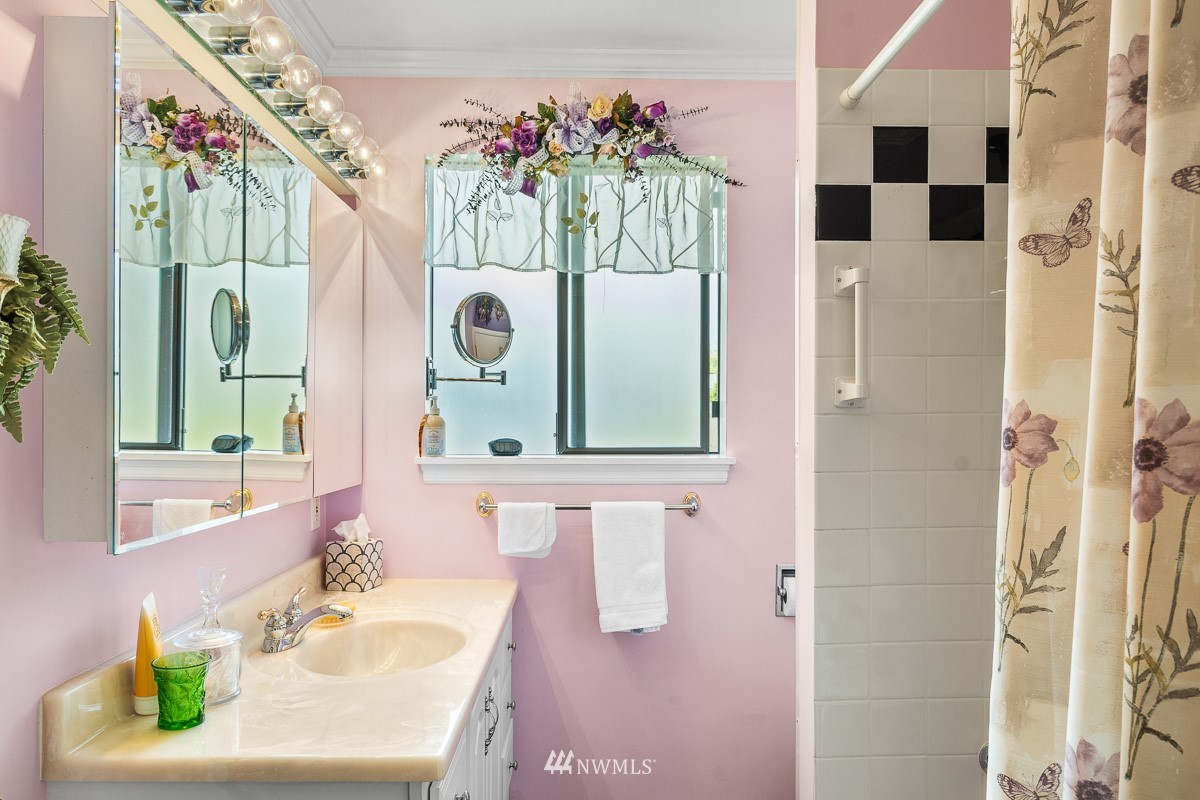 15053 Southeast 113th Street Renton, WA 98059 - Photo 19 of 31 a bathroom with a sink and a mirror