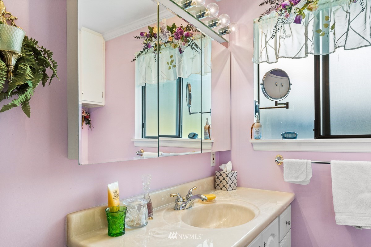 15053 Southeast 113th Street Renton, WA 98059 - Photo 20 of 31 a bathroom with a sink and a mirror