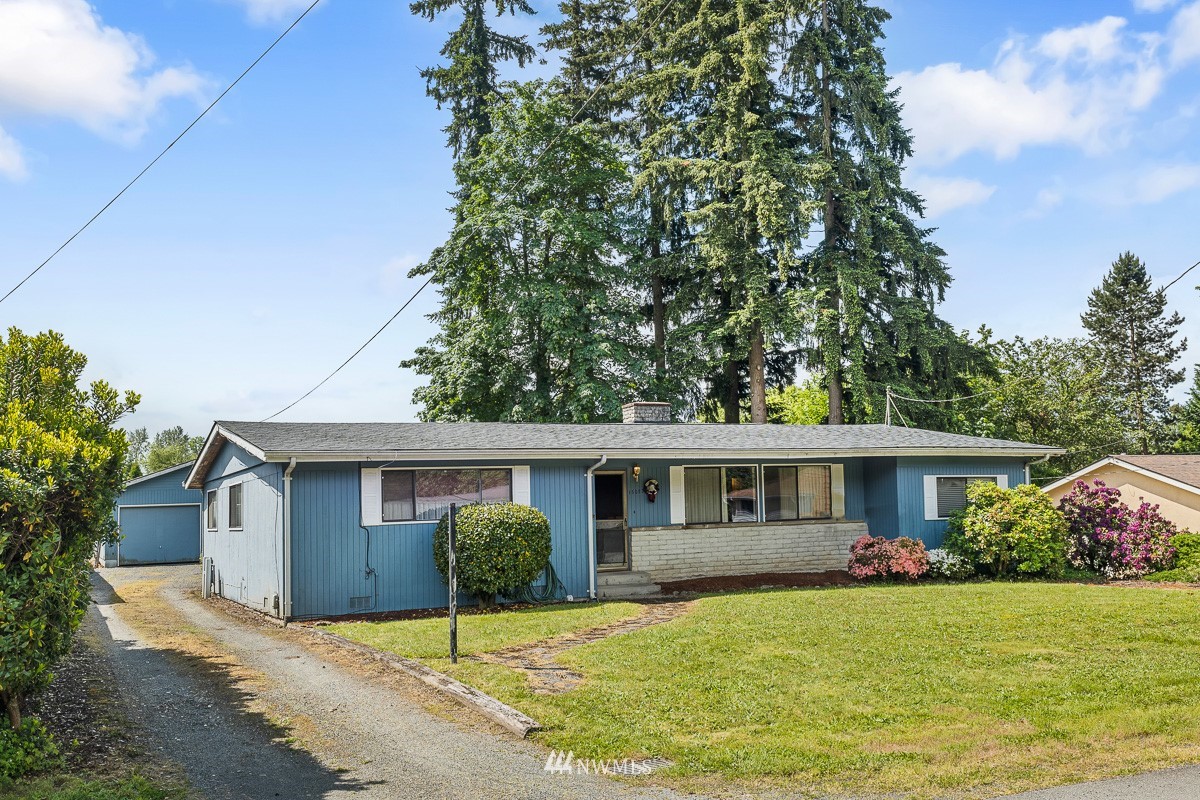 15053 Southeast 113th Street Renton, WA 98059 - Photo 2 of 31 a view of a house with a yard