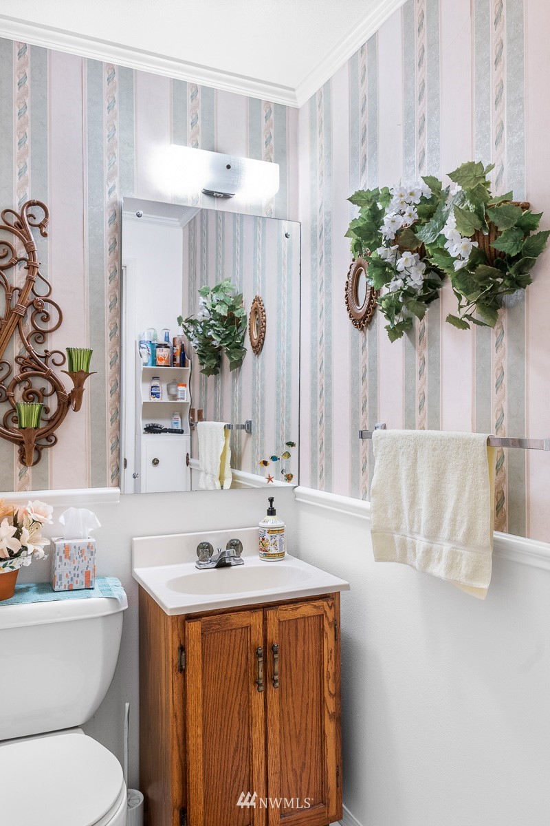 15053 Southeast 113th Street Renton, WA 98059 - Photo 23 of 31 a bathroom with a sink a toilet and a mirror