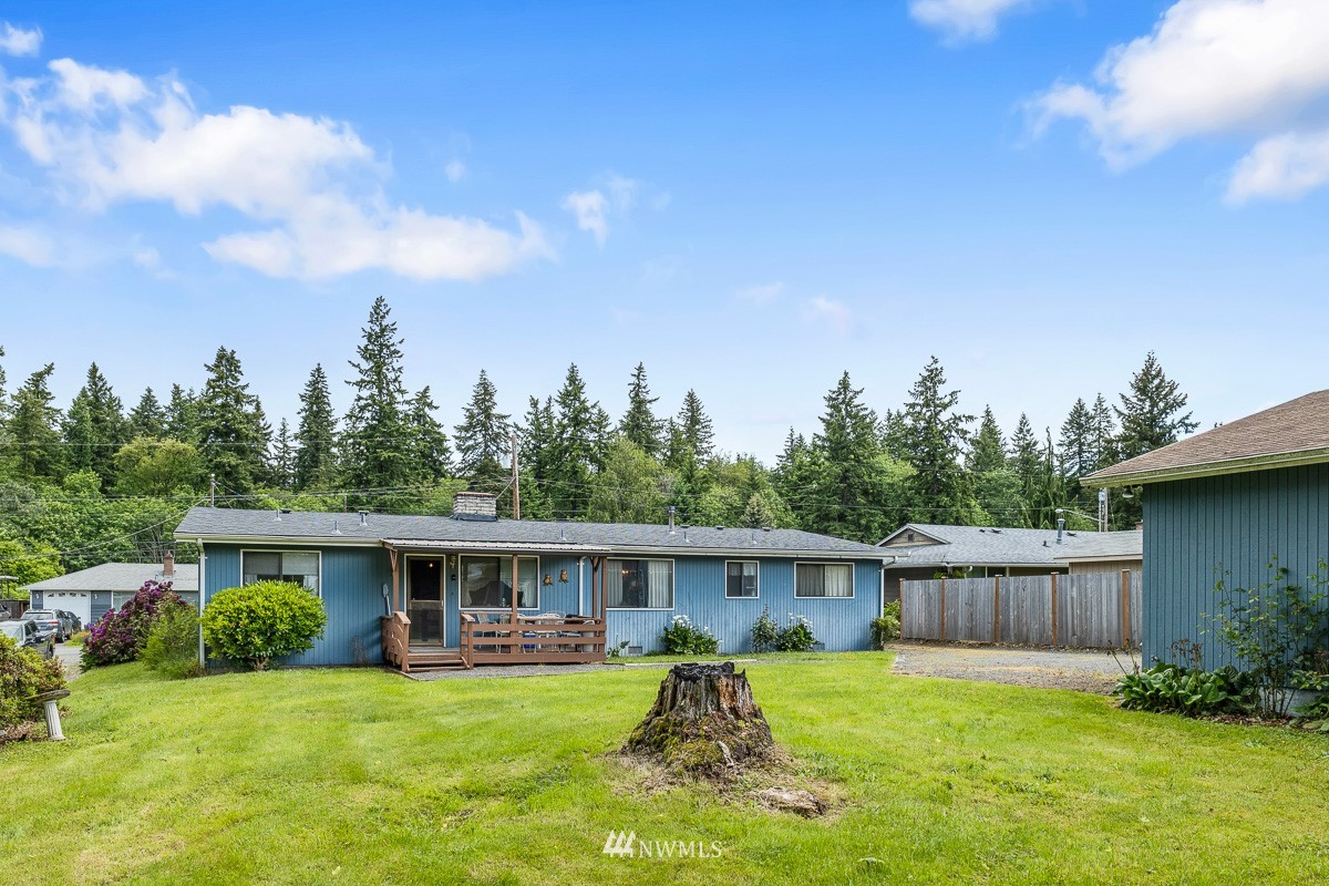 15053 Southeast 113th Street Renton, WA 98059 - Photo 30 of 31 a view of a house with a yard and sitting area