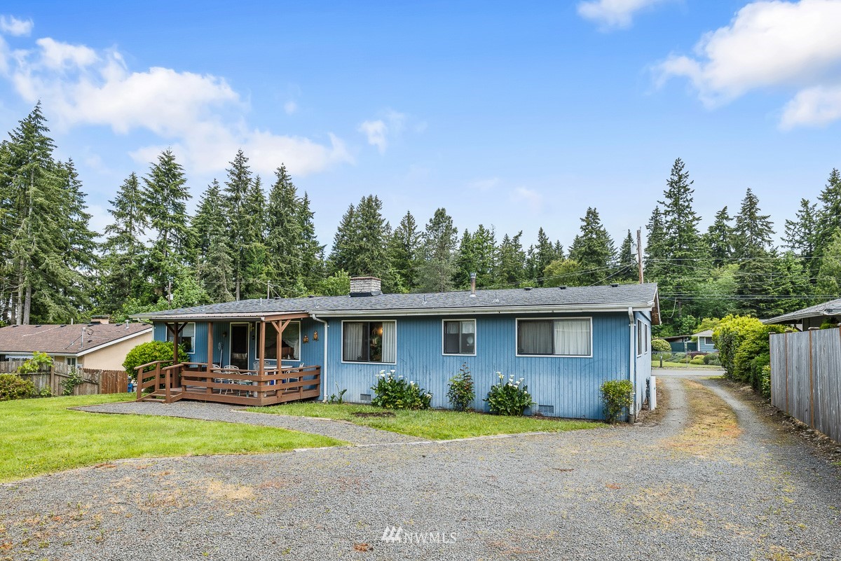 15053 Southeast 113th Street Renton, WA 98059 - Photo 3 of 31 front view of a house with a patio