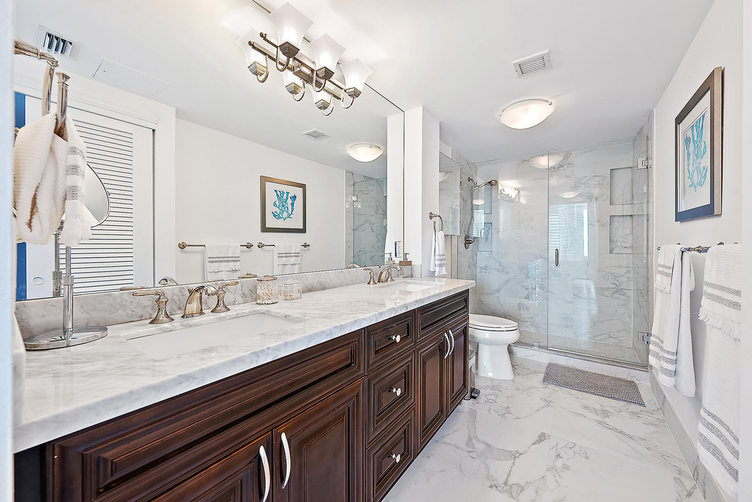 2780 South Ocean Boulevard, Unit 707 Palm Beach, FL 33480 - Photo 15 of 33 a bathroom with a granite countertop sink a toilet a mirror and shower