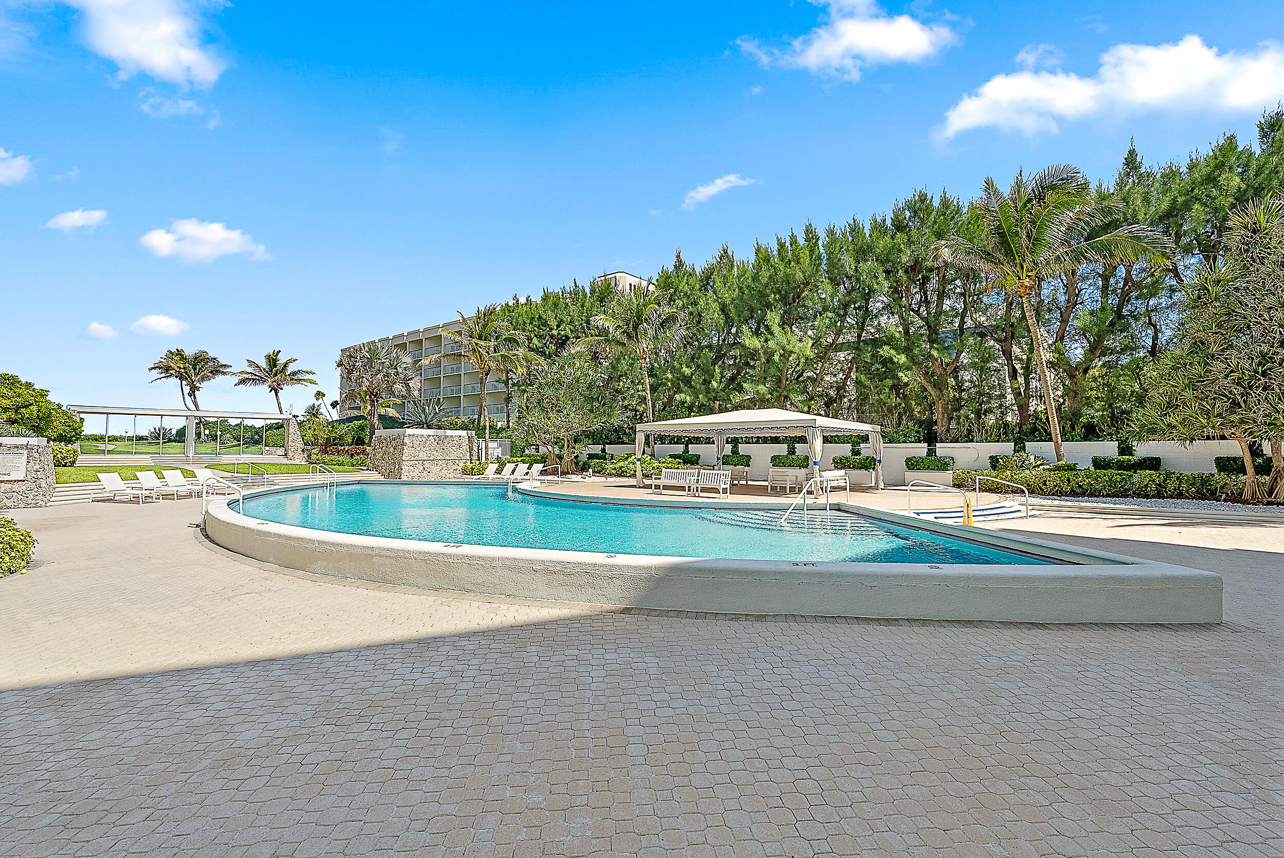 2780 South Ocean Boulevard, Unit 707 Palm Beach, FL 33480 - Photo 19 of 33 a view of a swimming pool with an outdoor space and seating area