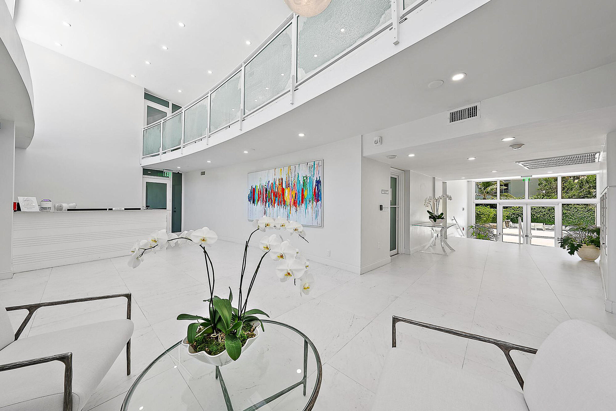 2780 South Ocean Boulevard, Unit 707 Palm Beach, FL 33480 - Photo 30 of 33 a white kitchen with cabinets and a potted plant