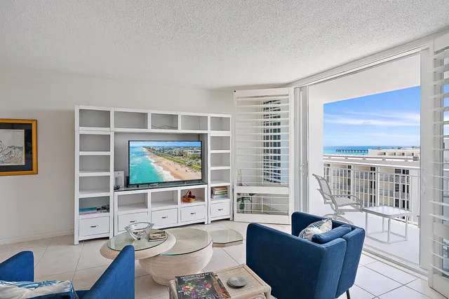 a view of a living room and entry way