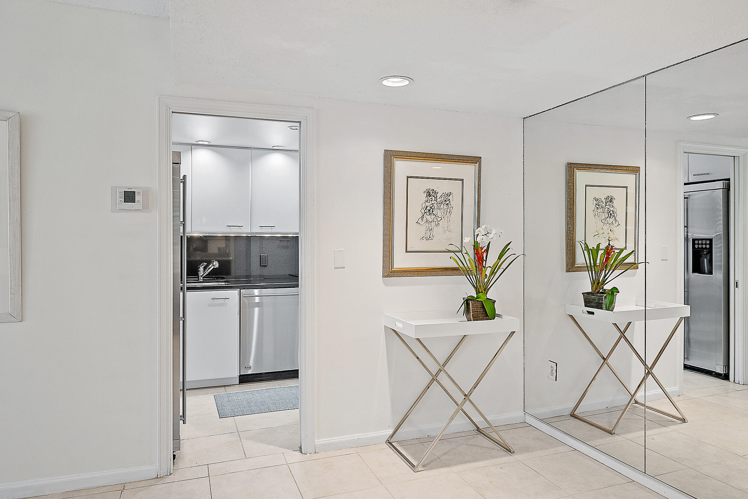 2780 South Ocean Boulevard, Unit 707 Palm Beach, FL 33480 - Photo 9 of 33 a living room with furniture and a view of kitchen