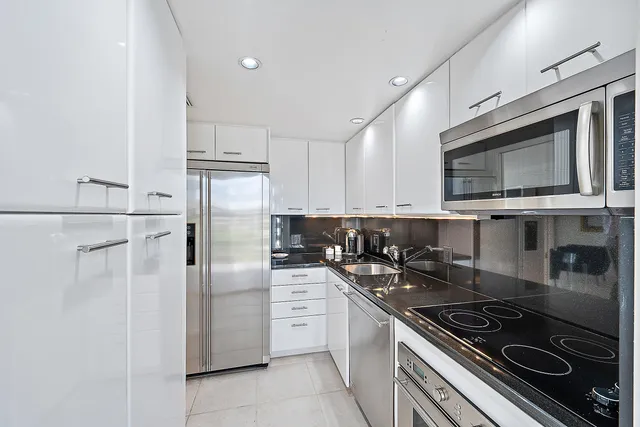 a view of a swimming pool with an outdoor space and seating area