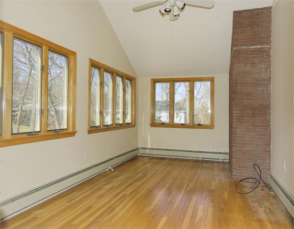 10 Phinney Road Lexington, MA 02421 - Photo 11 of 30 a view of an empty room with a window and wooden floor