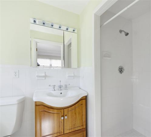 10 Phinney Road Lexington, MA 02421 - Photo 17 of 30 a bathroom with a sink a toilet and shower