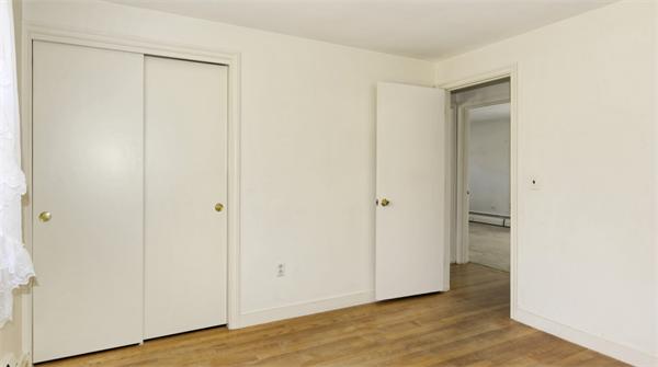 10 Phinney Road Lexington, MA 02421 - Photo 21 of 30 a view of an empty room with wooden floor and closet