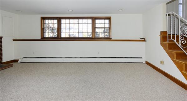 10 Phinney Road Lexington, MA 02421 - Photo 24 of 30 a view of a room with rack on the wall and a window