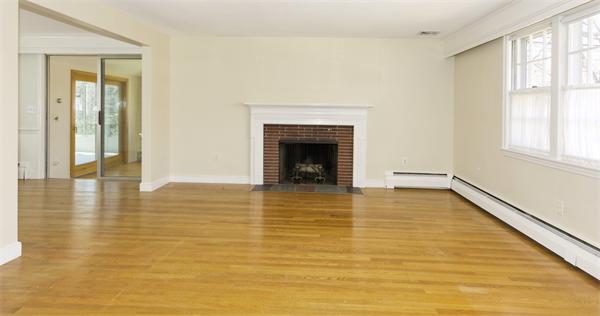 10 Phinney Road Lexington, MA 02421 - Photo 4 of 30 a view of an empty room with window and wooden floor