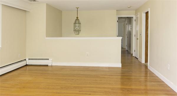 10 Phinney Road Lexington, MA 02421 - Photo 5 of 30 a view of an empty room with wooden floor