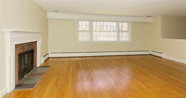 10 Phinney Road Lexington, MA 02421 - Photo 6 of 30 a view of an empty room with wooden floor and a window