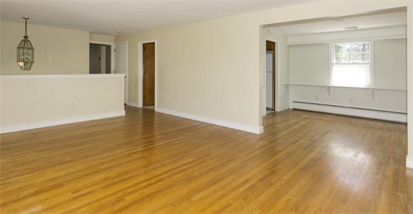 10 Phinney Road Lexington, MA 02421 - Photo 7 of 30 an empty room with wooden floor and windows