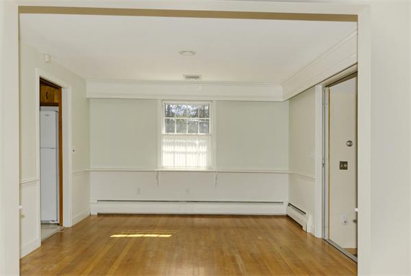 10 Phinney Road Lexington, MA 02421 - Photo 8 of 30 a view of a room with an empty space and a window