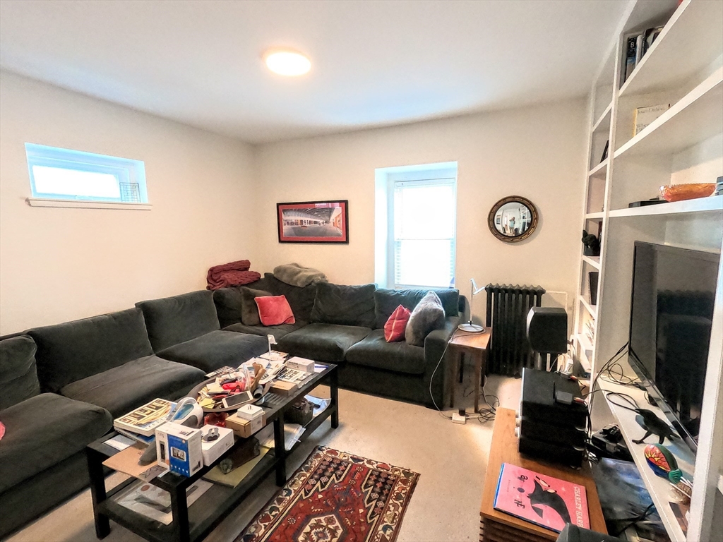 41 School Street, Unit 2 Boston, MA 02119 - Photo 3 of 36 a living room with furniture and a flat screen tv