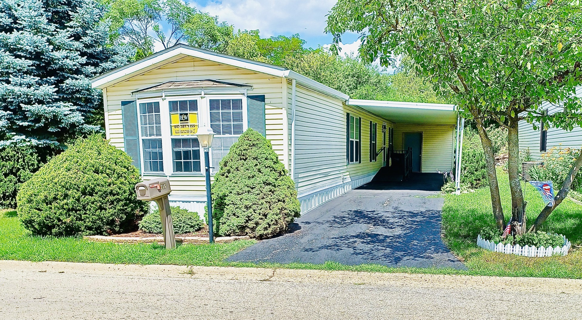715 Hillcrest Lane Crystal Lake, IL 60014 - Photo 1 of 13 a front view of a house with a yard and trees