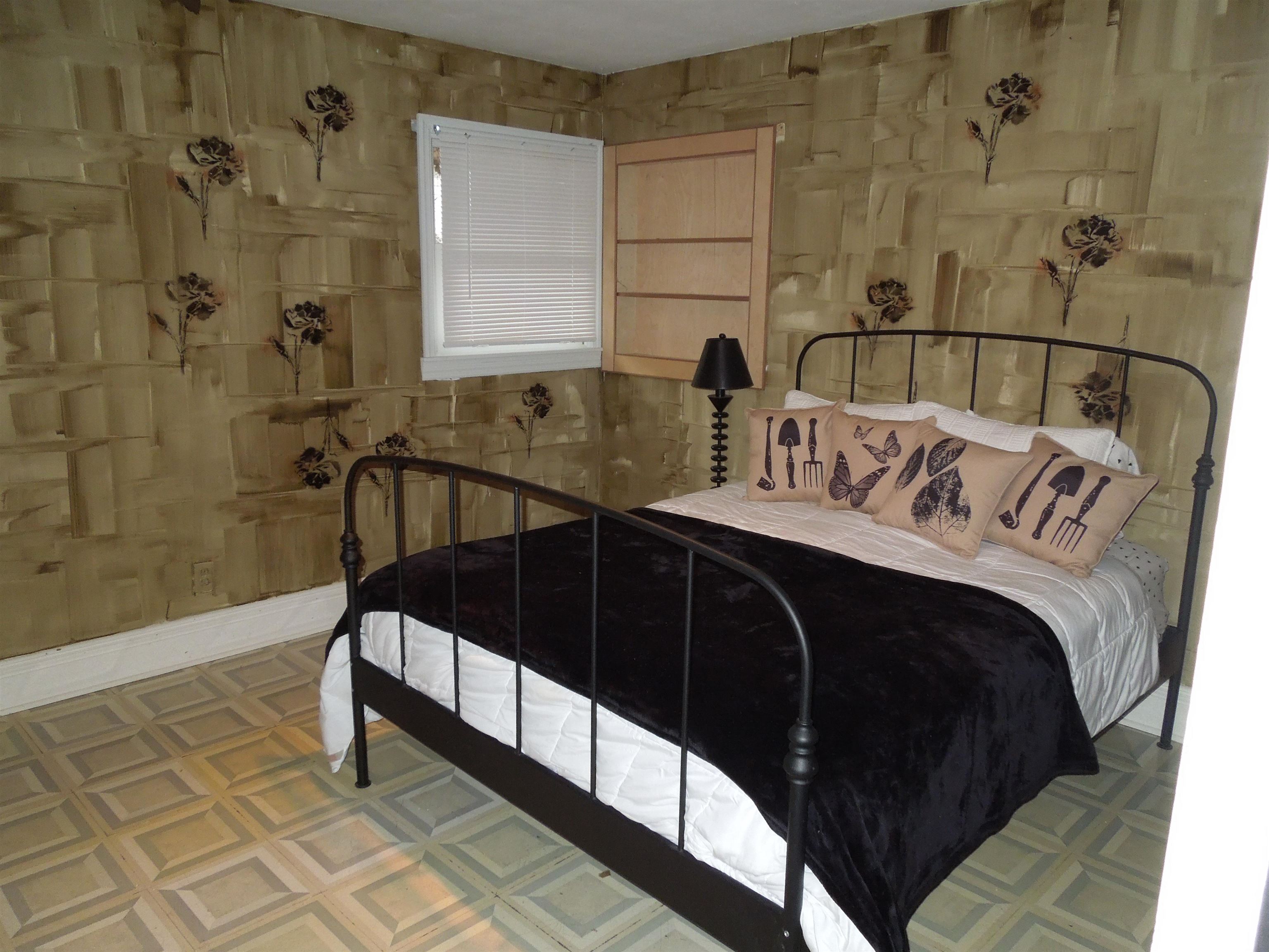 4721 Brookview Road Rockford, IL 61107 - Photo 12 of 26 a bedroom with a bed and a shower
