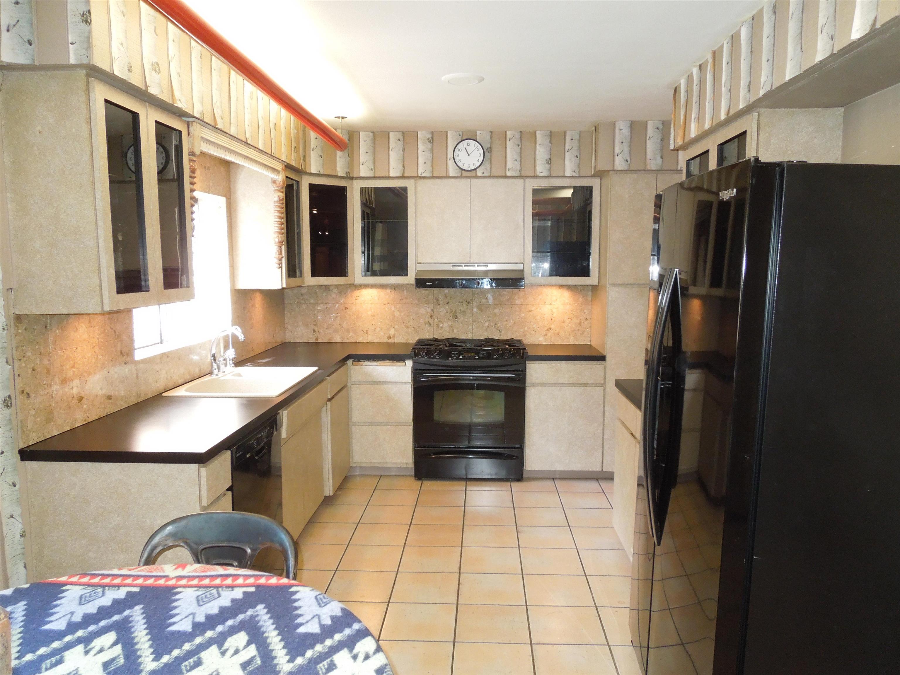 4721 Brookview Road Rockford, IL 61107 - Photo 13 of 26 a kitchen with stainless steel appliances granite countertop a refrigerator a stove and a sink