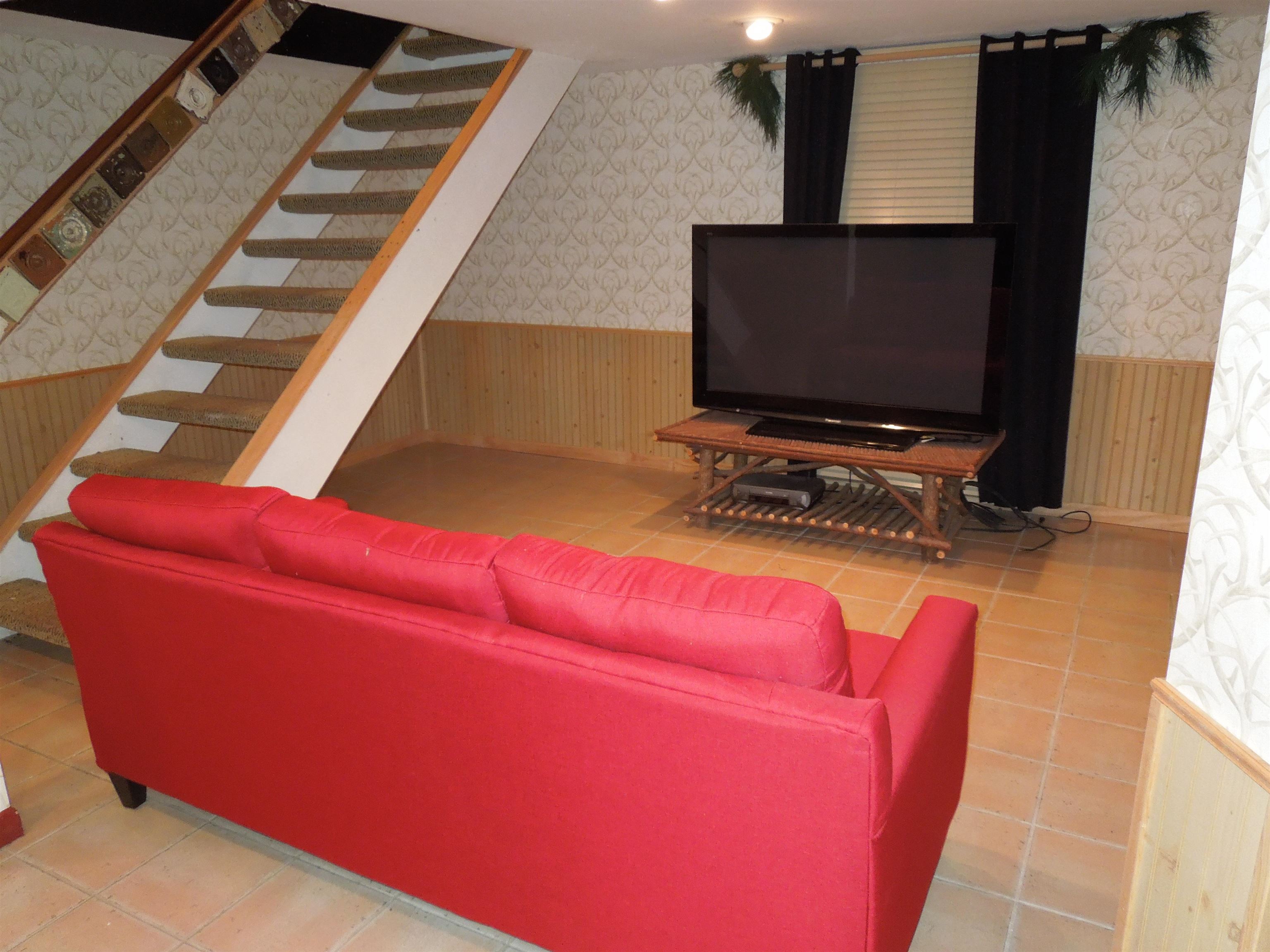 4721 Brookview Road Rockford, IL 61107 - Photo 18 of 26 a room with furniture and a flat screen tv
