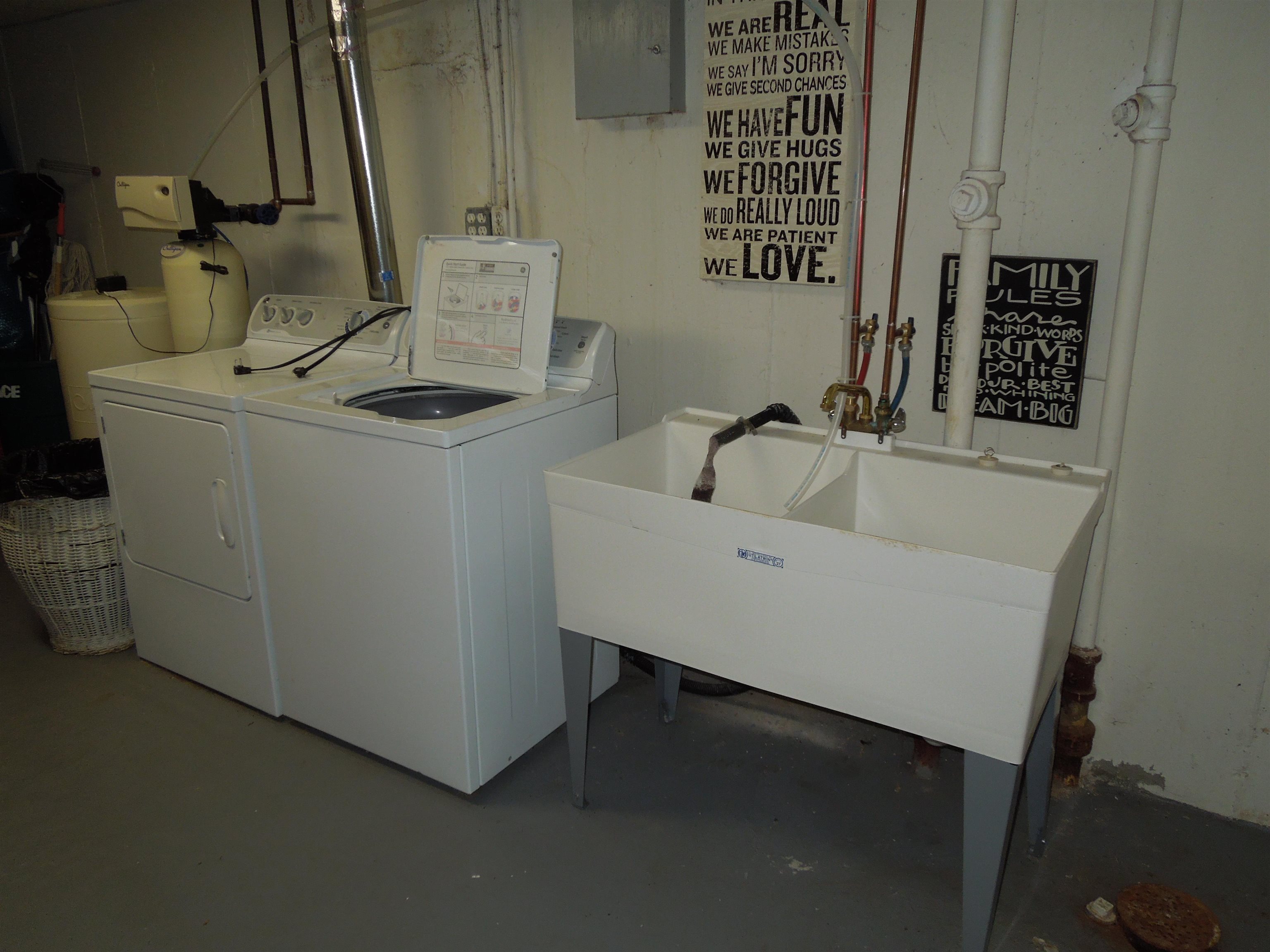 4721 Brookview Road Rockford, IL 61107 - Photo 24 of 26 a bathroom with a sink and a washing machine