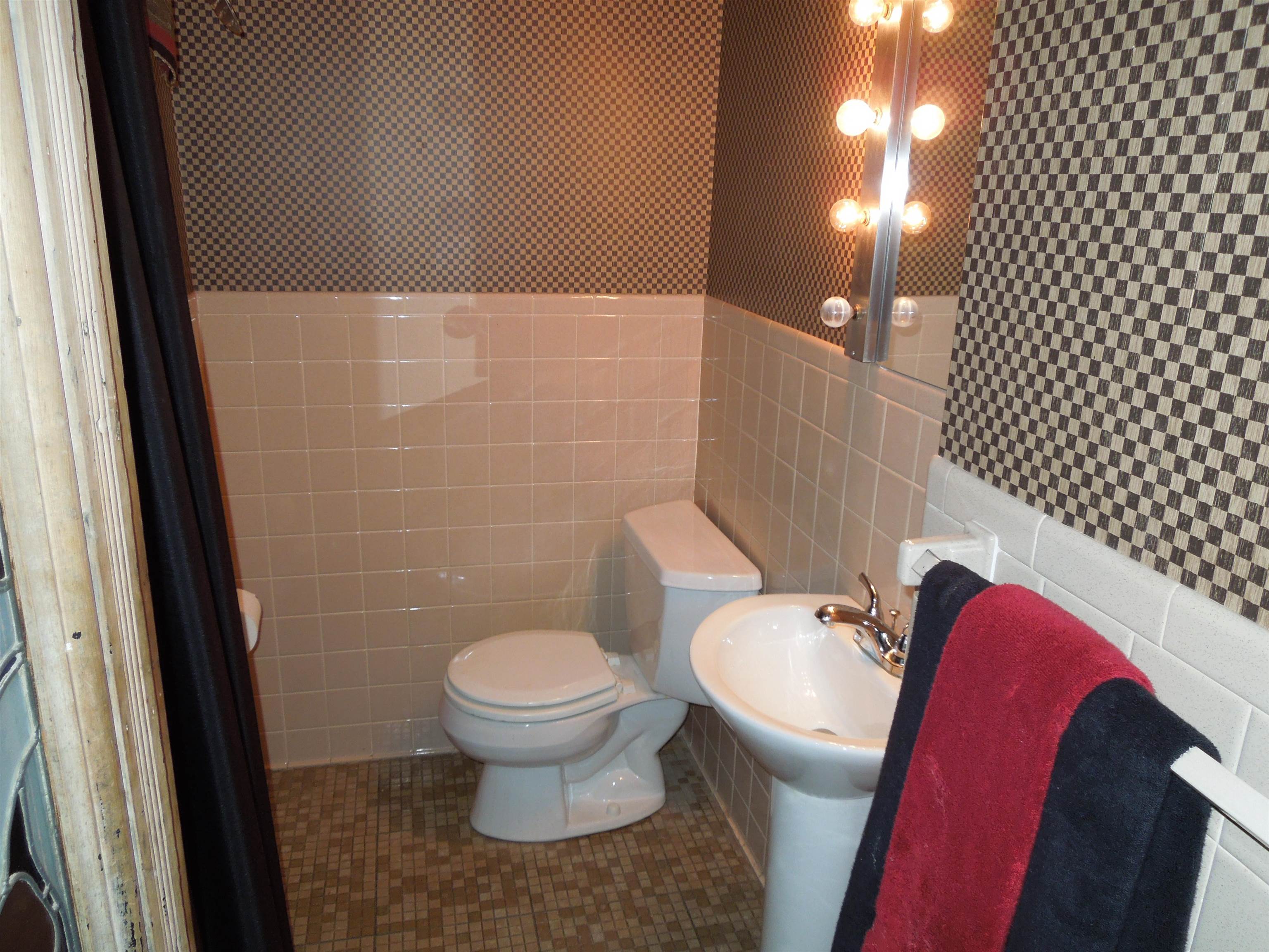 4721 Brookview Road Rockford, IL 61107 - Photo 8 of 26 a bathroom with a toilet and a shower