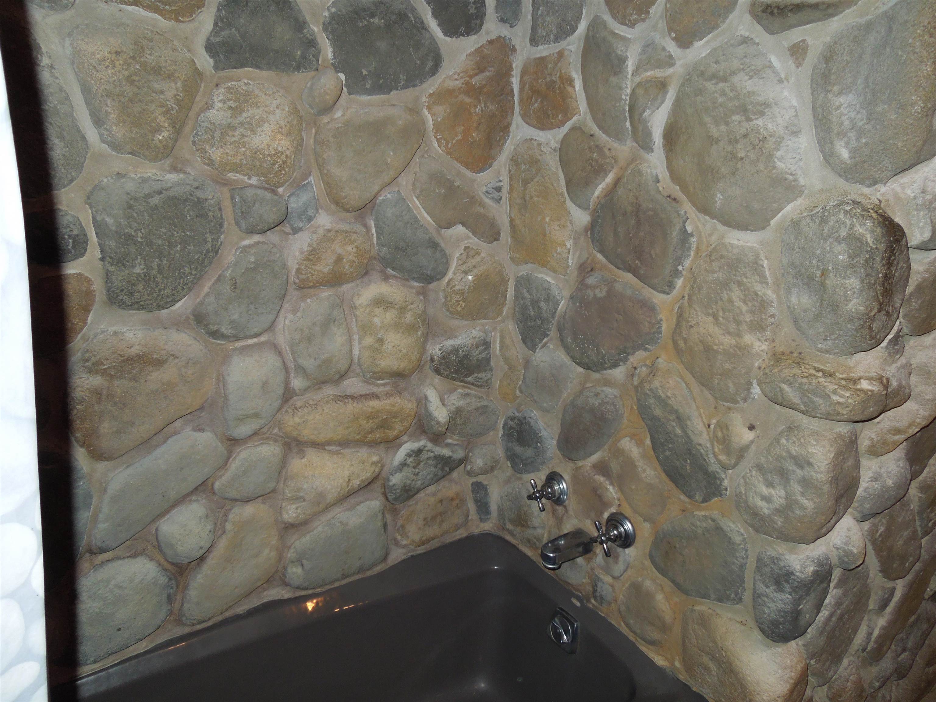 4721 Brookview Road Rockford, IL 61107 - Photo 10 of 26 a bathroom with a bathtub