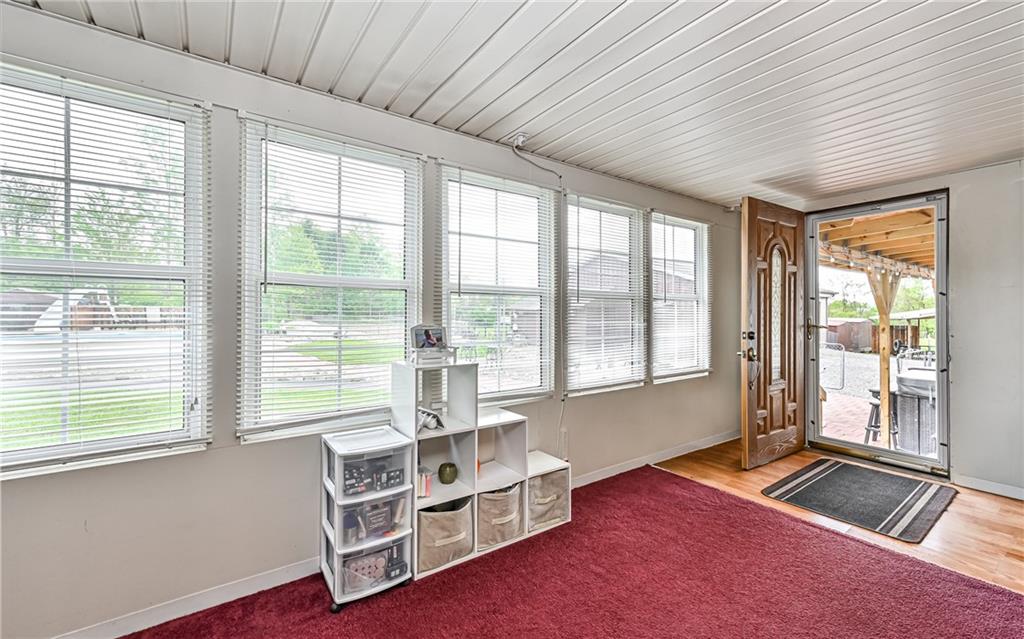 307 Hungarian Road Slippery Rock, PA 16057 - Photo 20 of 34 a living room with furniture and floor to ceiling windows