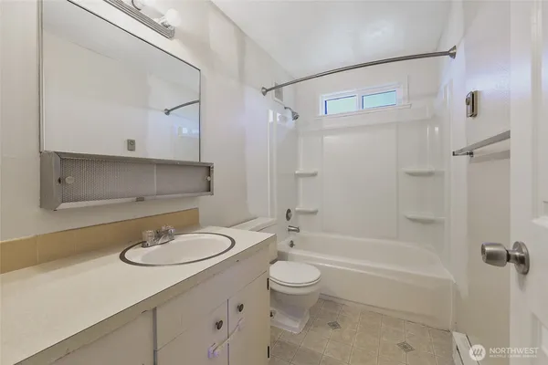 a bathroom with a sink toilet a shower and bathtub