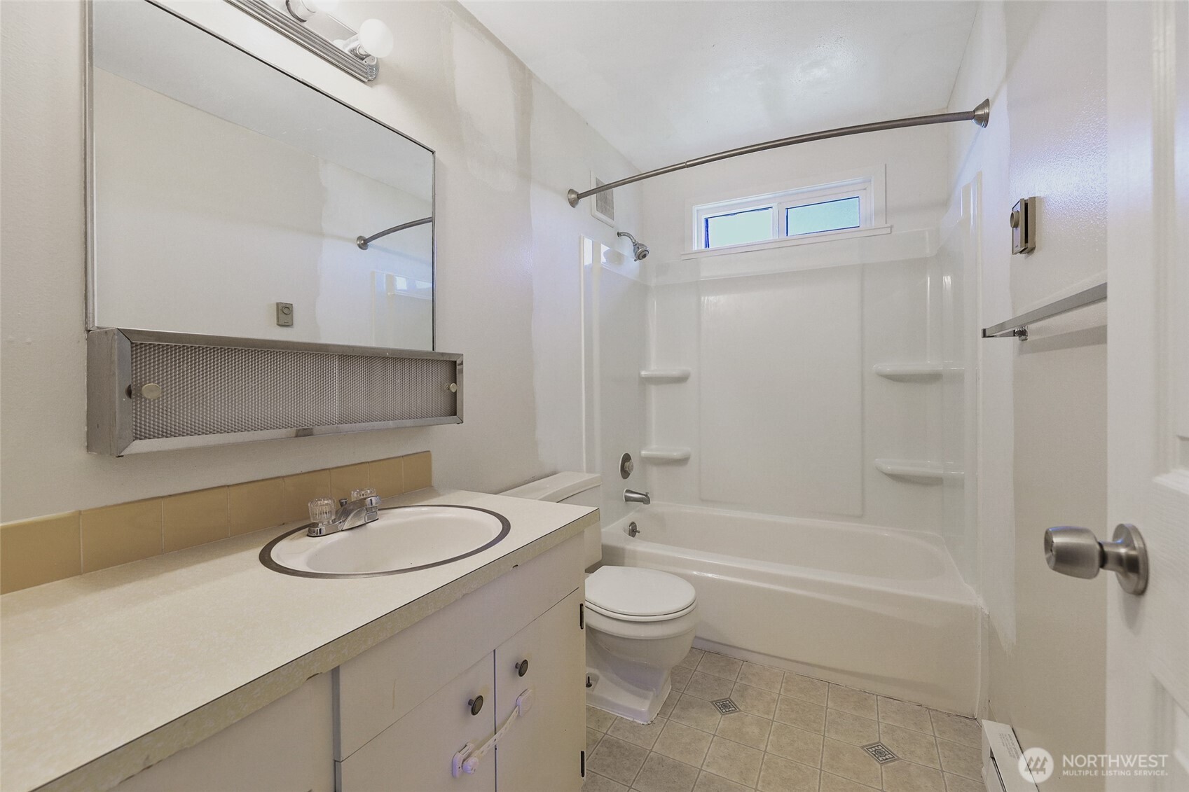 1719 North Willow Road Spokane Valley, WA 99206 - Photo 15 of 27 a bathroom with a sink toilet a shower and bathtub