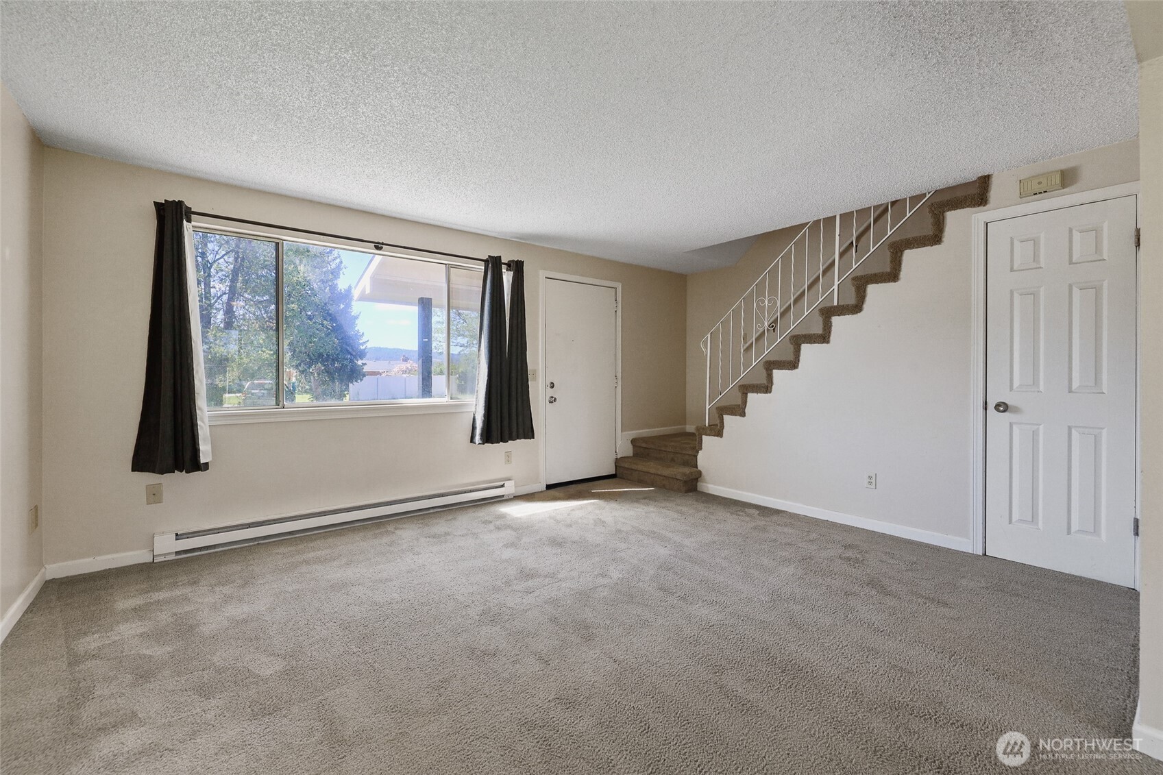 1719 North Willow Road Spokane Valley, WA 99206 - Photo 6 of 27 a view of an empty room with a window
