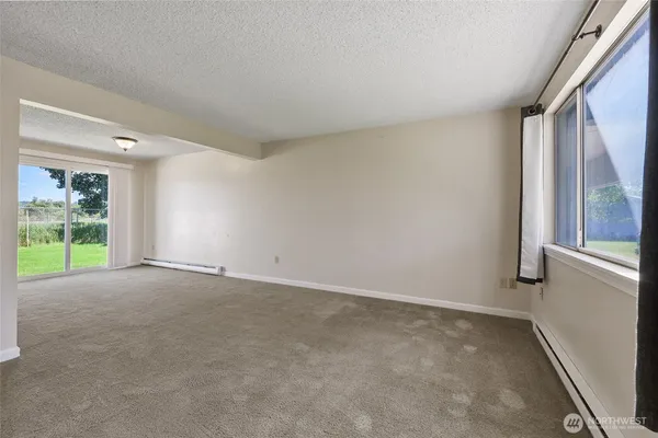 a view of an empty room with a window