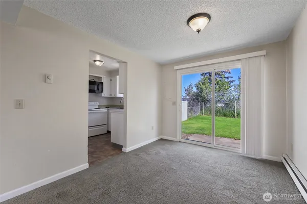 a view of livingroom with furniture and floor to ceiling window