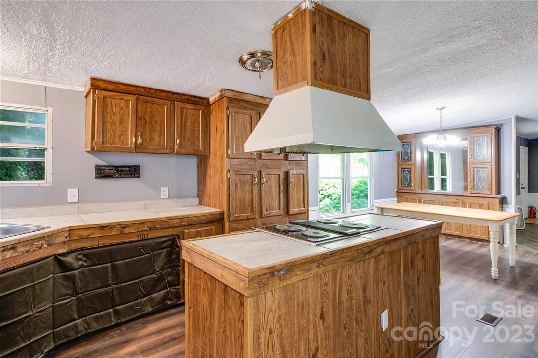 65 Hickory Nut Drive Mill Spring, NC 28756 - Photo 16 of 24 a kitchen that has a stove and a table