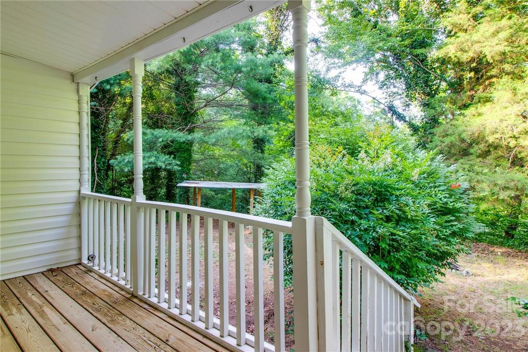 65 Hickory Nut Drive Mill Spring, NC 28756 - Photo 5 of 24 a view of a wooden roof deck
