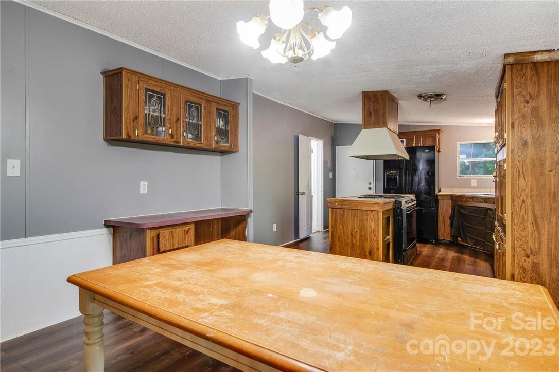 65 Hickory Nut Drive Mill Spring, NC 28756 - Photo 8 of 24 a bedroom with a bed and a chandelier