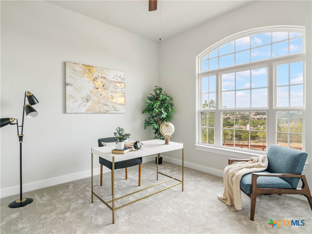 a work room with furniture and windows
