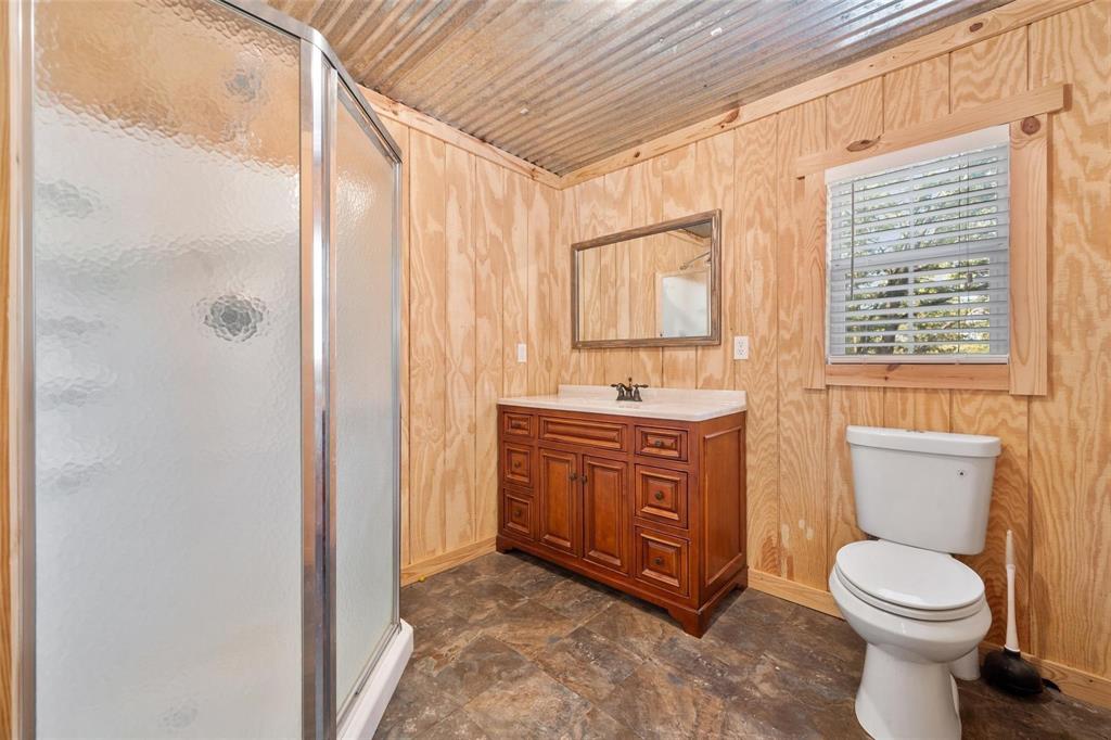134 Maple Avenue Streetman, TX 75859 - Photo 17 of 19 Full bathroom with a shower stall, vanity, and wooden ceiling