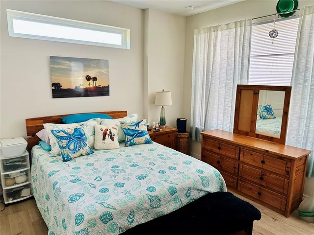 a bedroom with a bed and a dresser