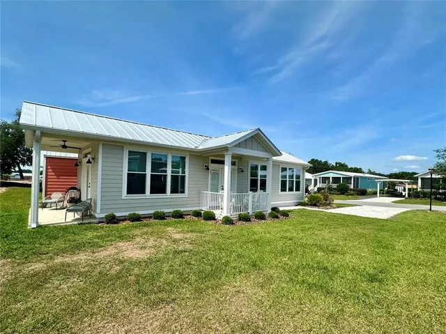 a front view of house with yard and porch