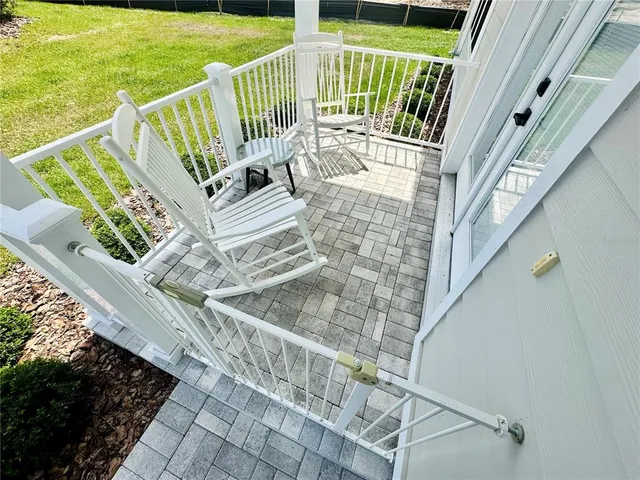 a view of balcony with furniture