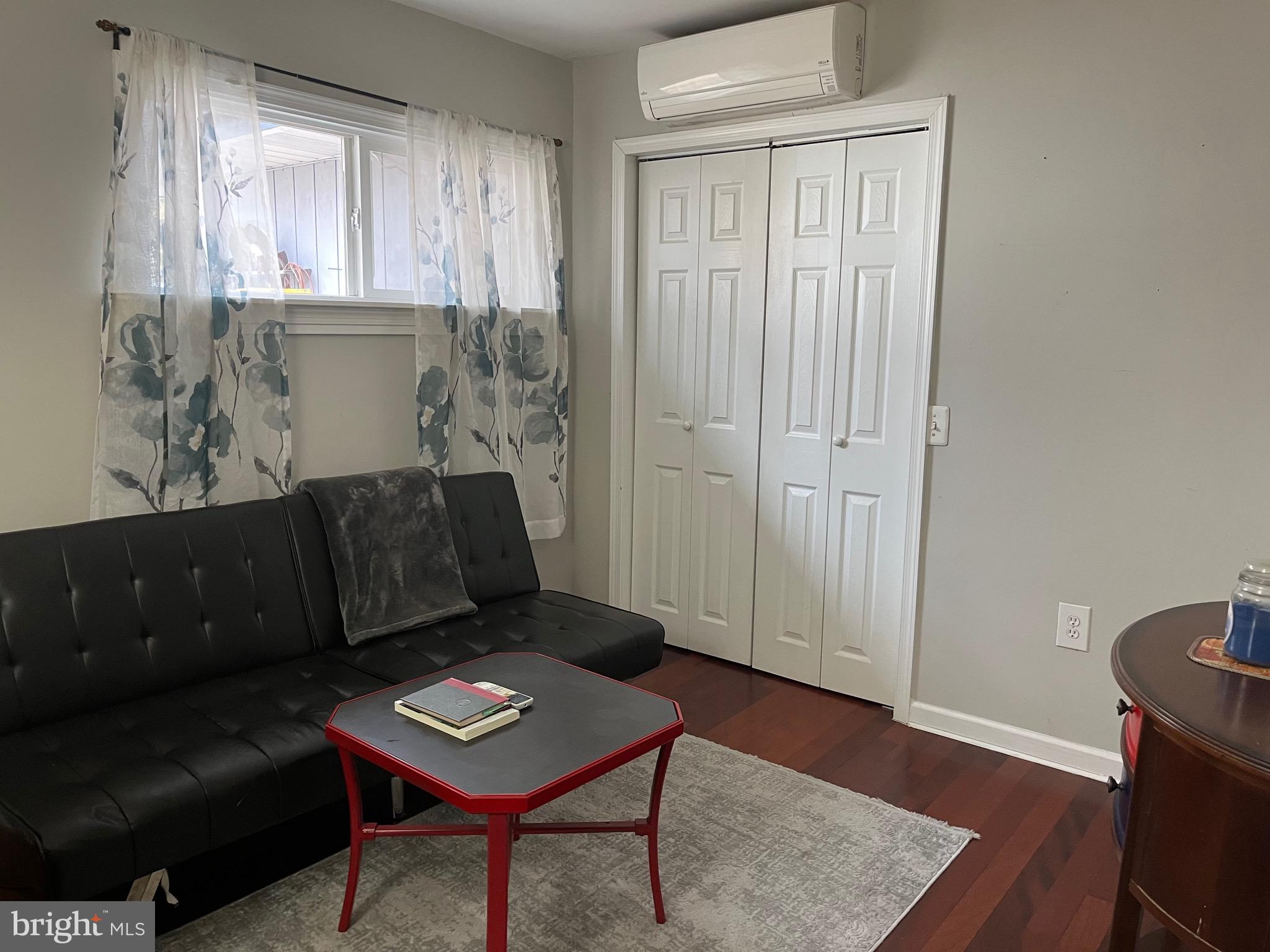 936 Wood Road Feasterville-Trevose, PA 19053 - Photo 14 of 29 a living room with furniture and a window