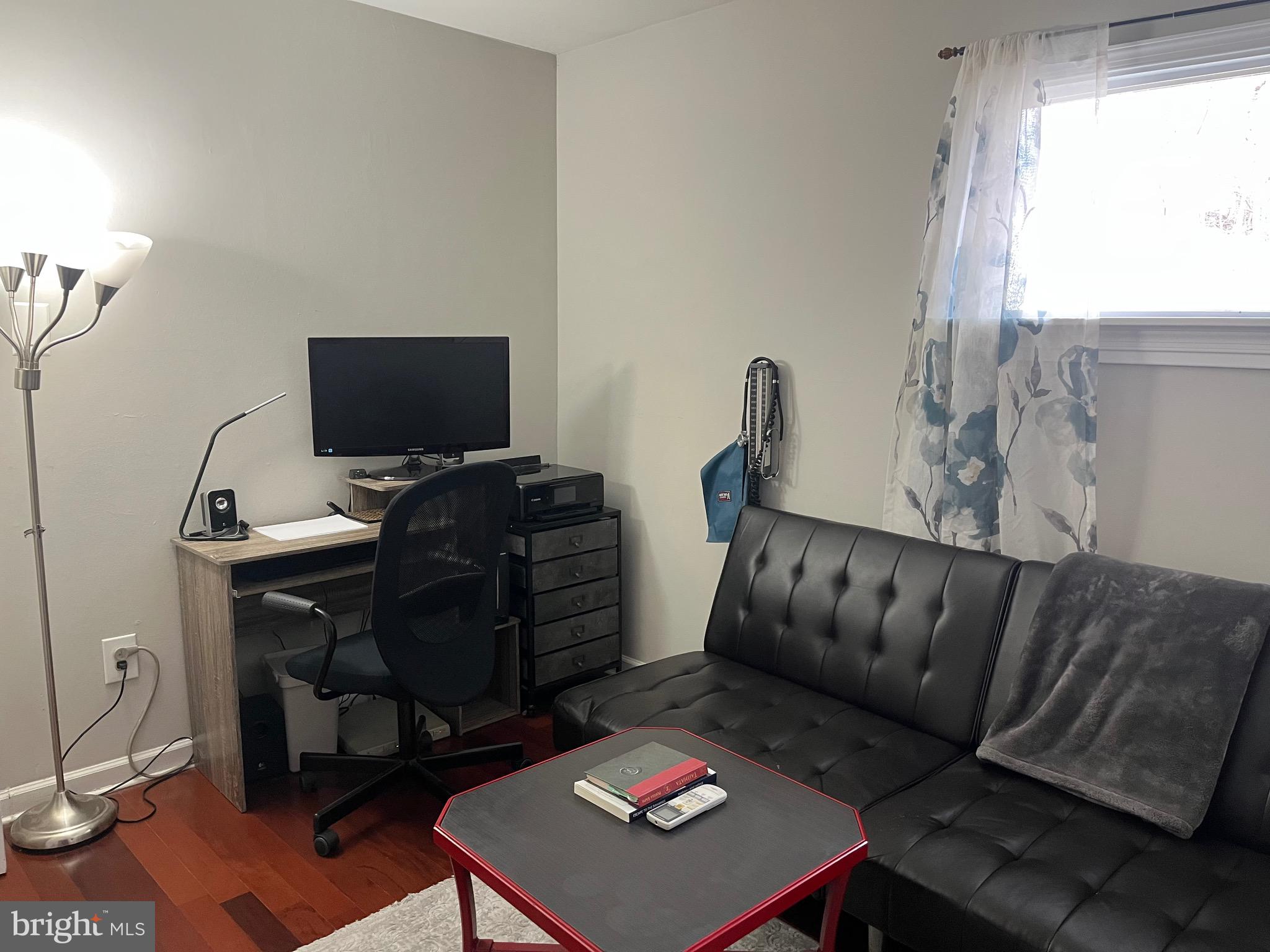 936 Wood Road Feasterville-Trevose, PA 19053 - Photo 15 of 29 a living room with furniture and a flat screen tv