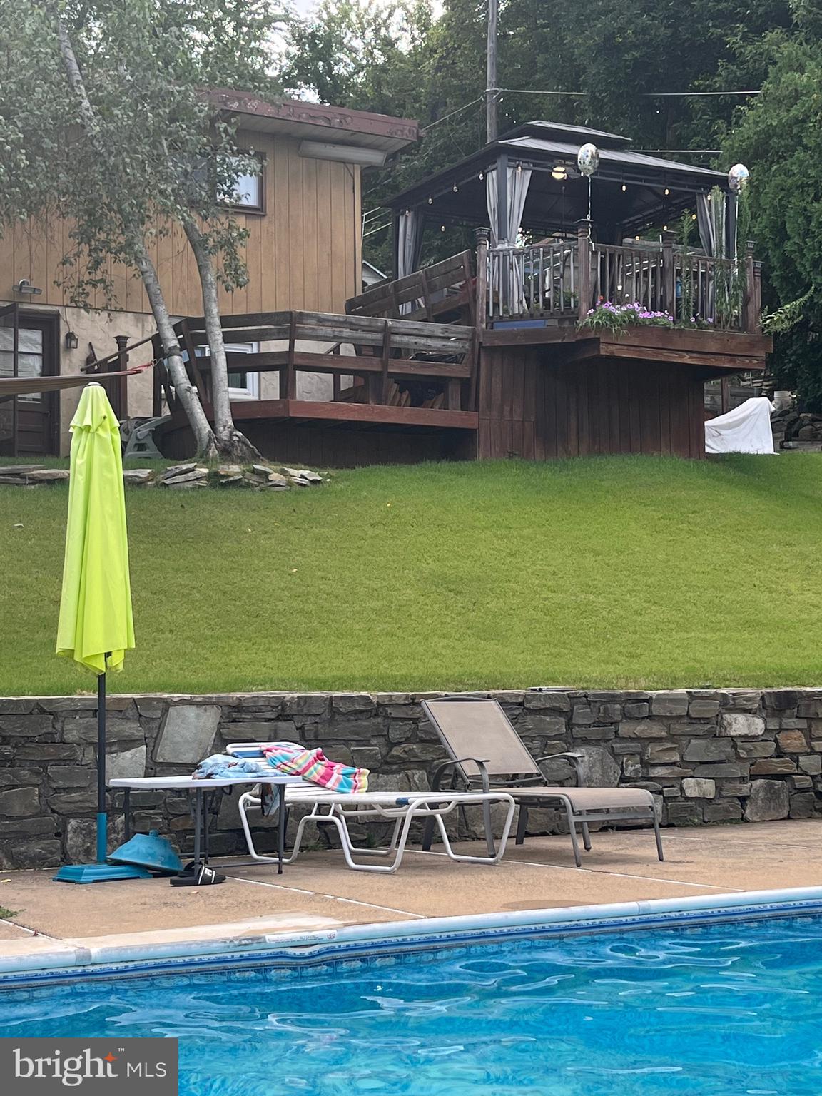 936 Wood Road Feasterville-Trevose, PA 19053 - Photo 20 of 29 a view of a house with a yard deck and sitting area