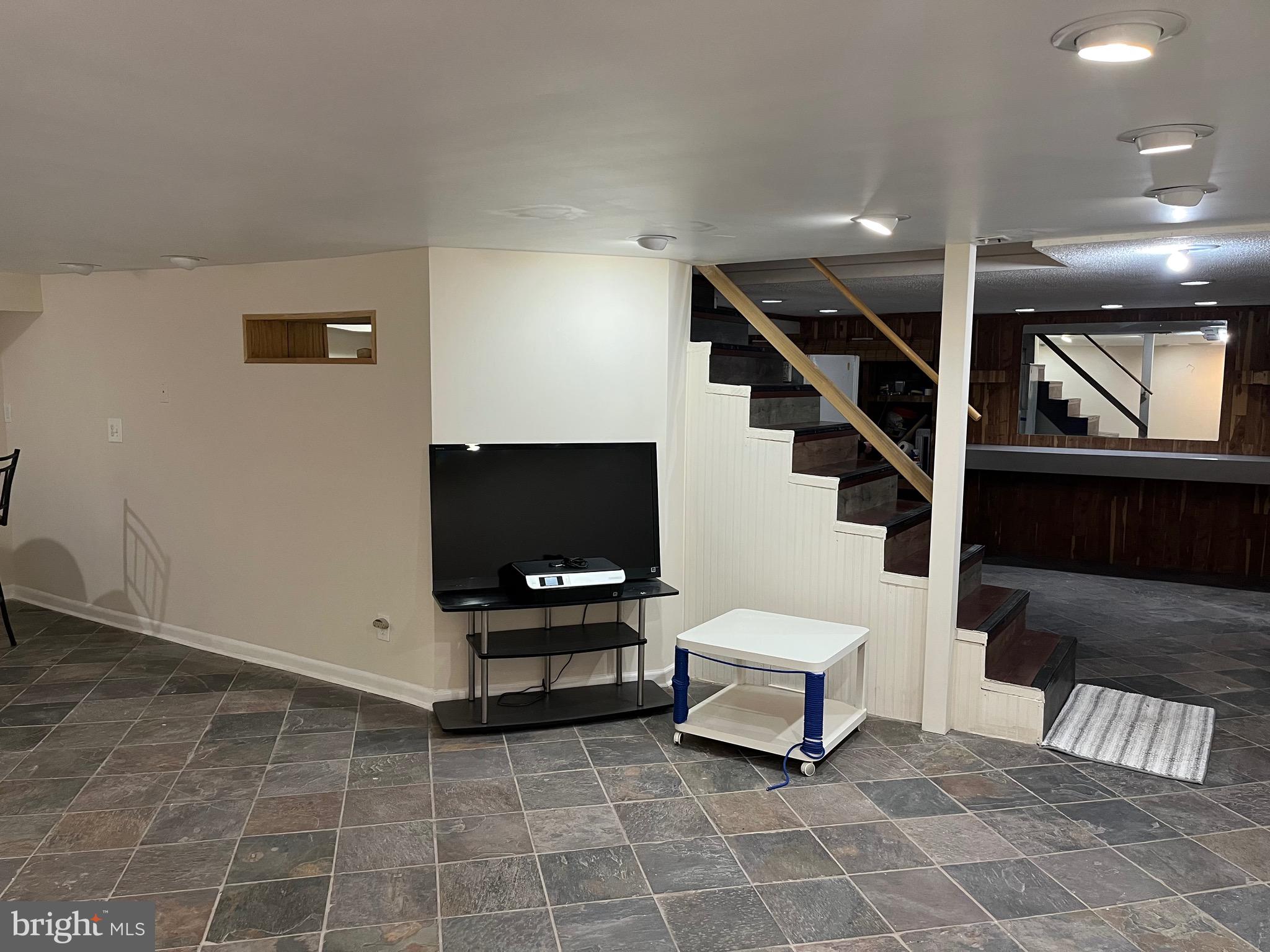 936 Wood Road Feasterville-Trevose, PA 19053 - Photo 26 of 29 a living room with furniture and a flat screen tv