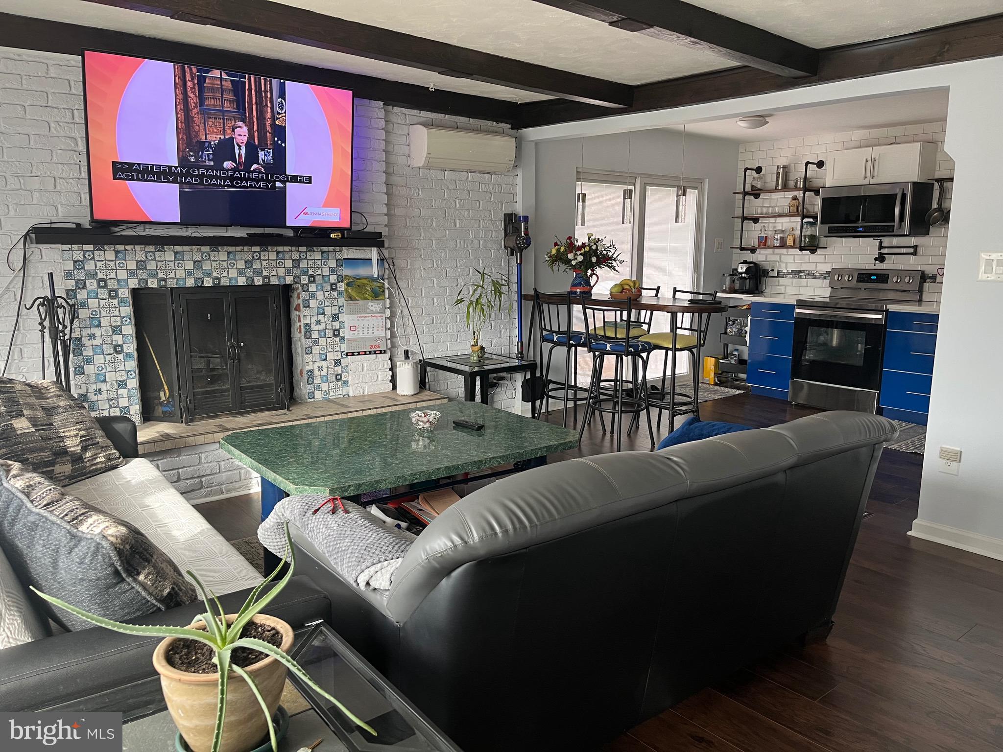 936 Wood Road Feasterville-Trevose, PA 19053 - Photo 3 of 29 a living room with furniture and a fireplace