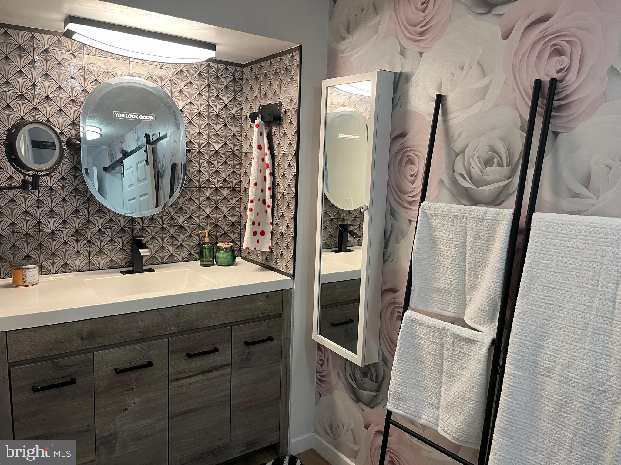 936 Wood Road Feasterville-Trevose, PA 19053 - Photo 9 of 29 a bathroom with a sink and a mirror