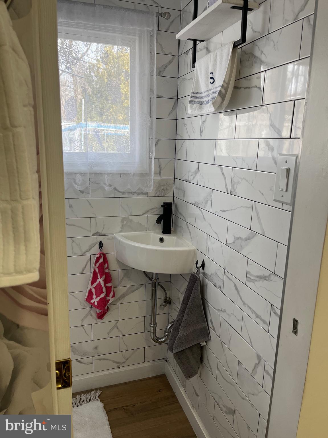 936 Wood Road Feasterville-Trevose, PA 19053 - Photo 10 of 29 a bathroom with a sink and a shower